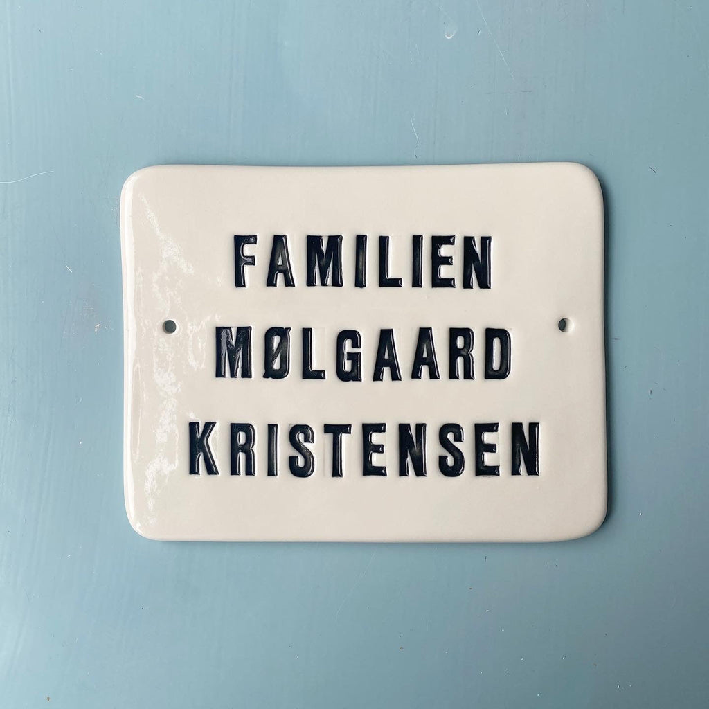 Nameplate with capital letters