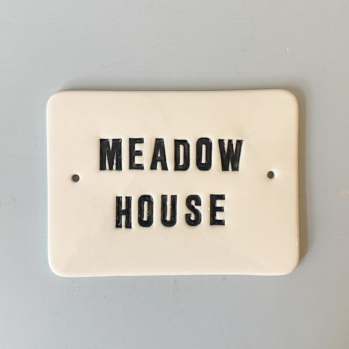 Nameplate with capital letters
