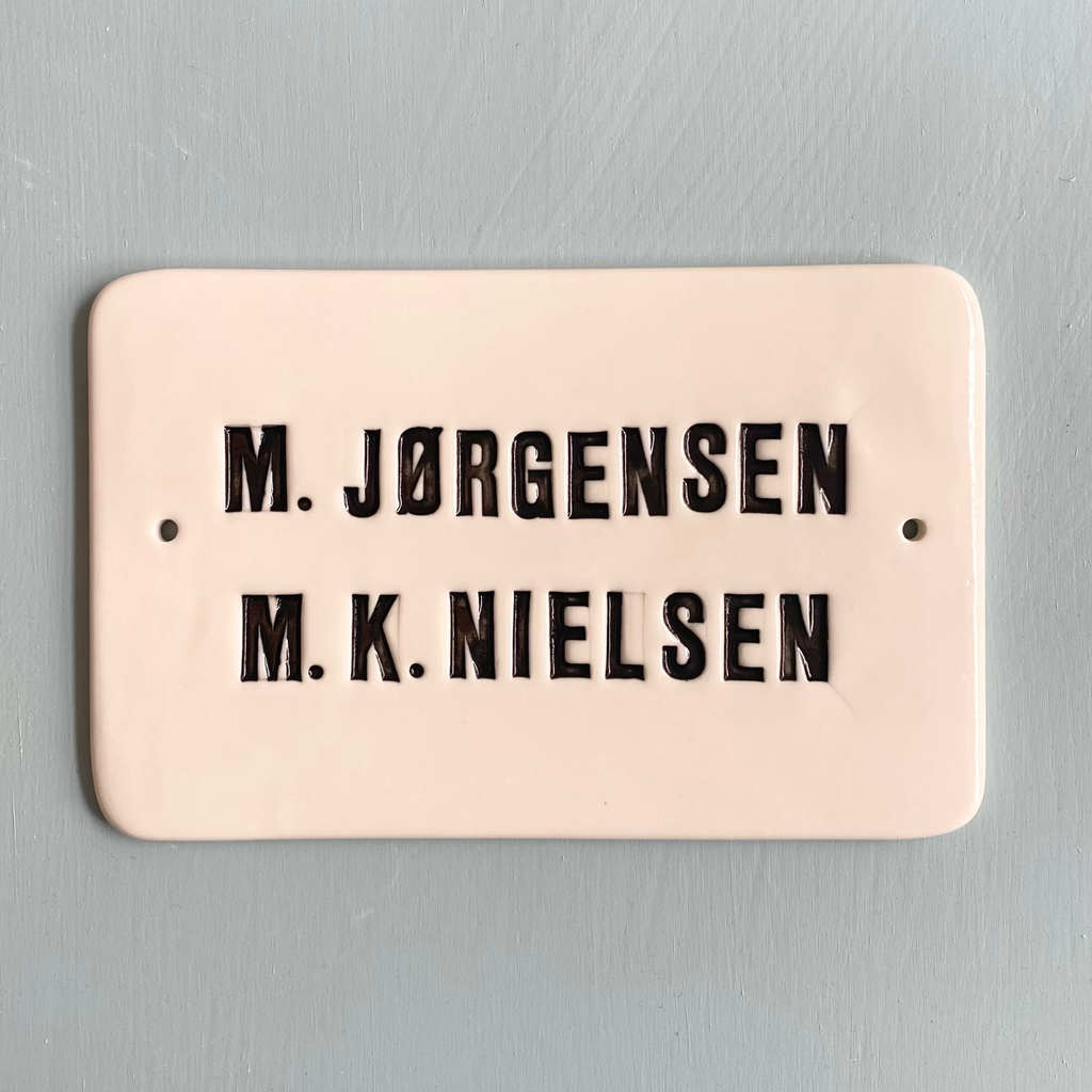 Nameplate with capital letters