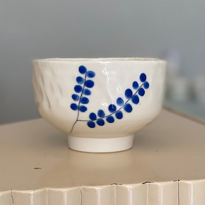 cup with blue leaves