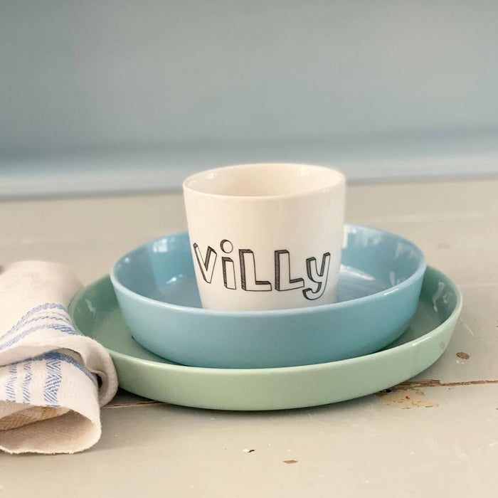 small cup with "family" letters