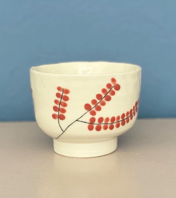 cup with red leaves