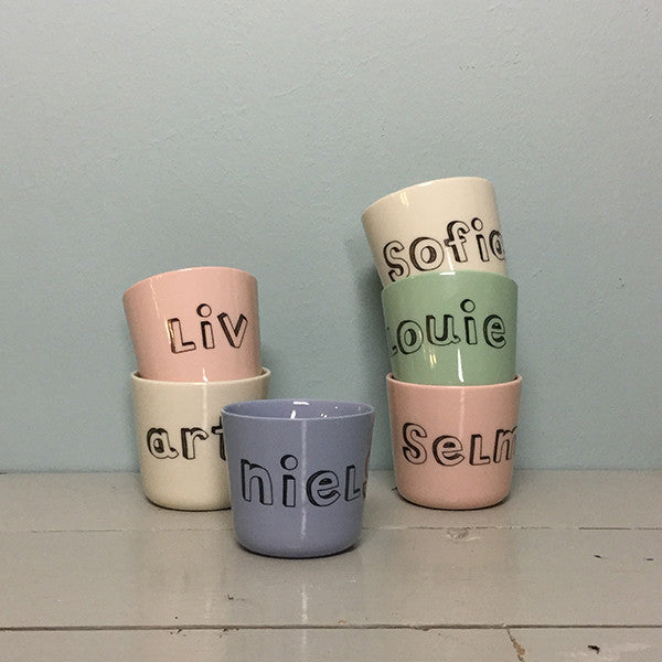 small cup with "family" letters