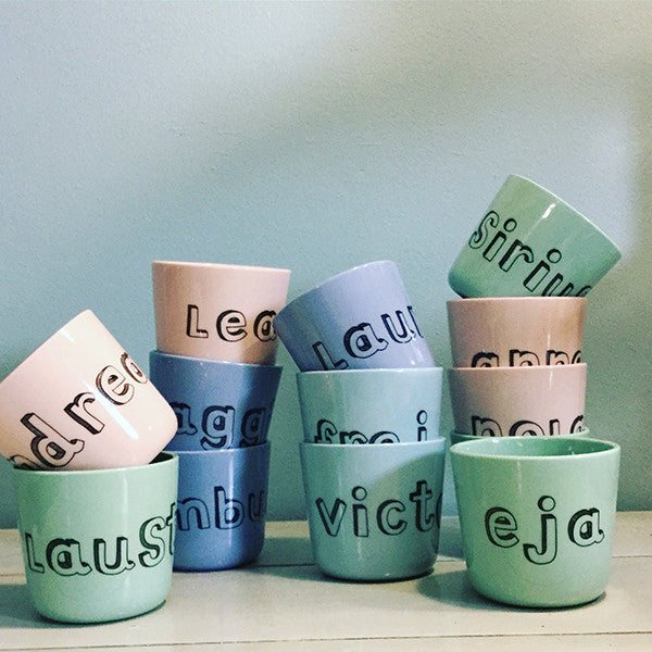 small cup with "family" letters